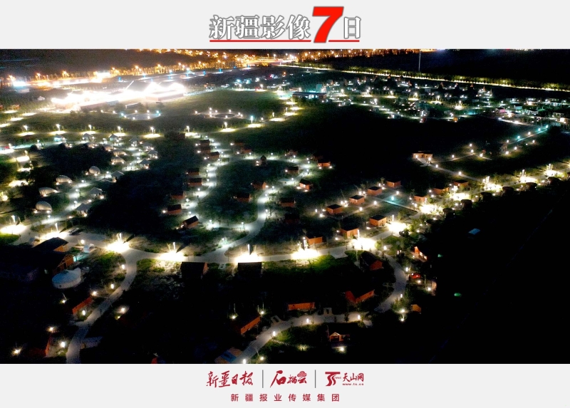 宛若銀河——   7月25日，烏爾禾國(guó)際房車露營(yíng)公園夜景。進(jìn)入盛夏時(shí)節(jié)，克拉瑪依市烏爾禾區(qū)新興旅游項(xiàng)目迎來(lái)大量嘗鮮的游客。其中，烏爾禾國(guó)際房車露營(yíng)公園頗為引人注目。營(yíng)地內(nèi)房屋星羅棋布，日間游客可體驗(yàn)各種游樂(lè)項(xiàng)目，夜間可在“宛若銀河”的營(yíng)地內(nèi)吃燒烤、看星空，感受多彩生活。石榴云/新疆日?qǐng)?bào)記者 韓亮攝